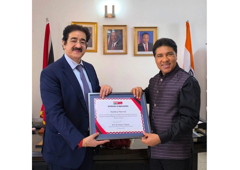 Dr. Sandeep Marwah Honored by H.E. Dr. Roger Gopaul, High Commissioner