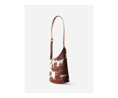 What Makes a Handcrafted Cowhide Shoulder Bag Unique?